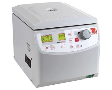 Laboratory centrifuge with digital display and control knobs for speed and time settings.
